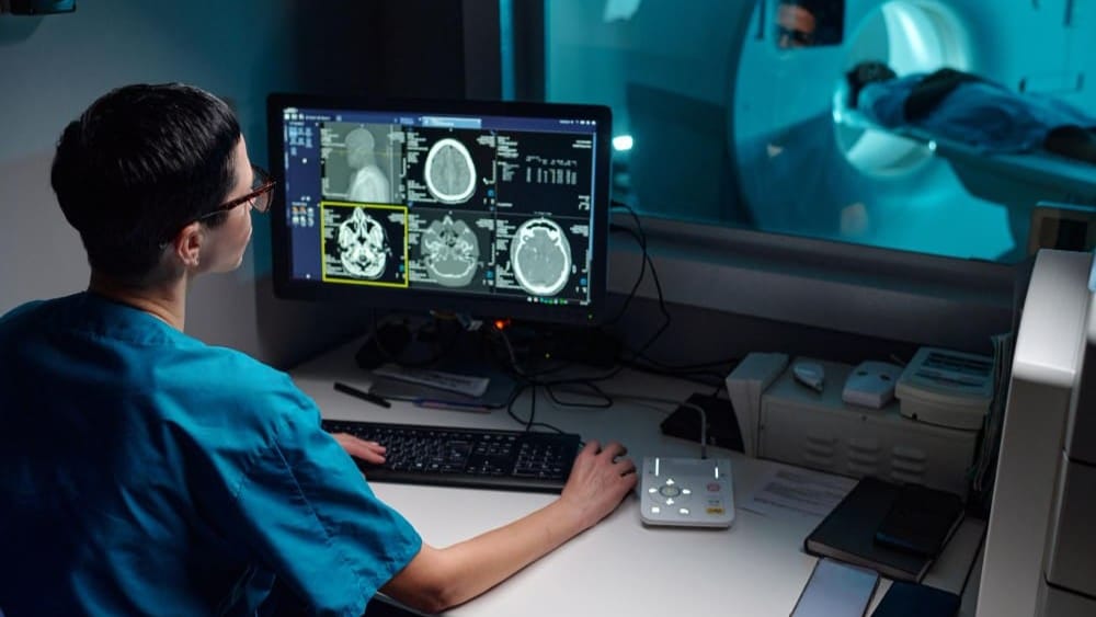 Students training on real-time MRI and CT scan machinery in the Advanced Diagnostic Wing.